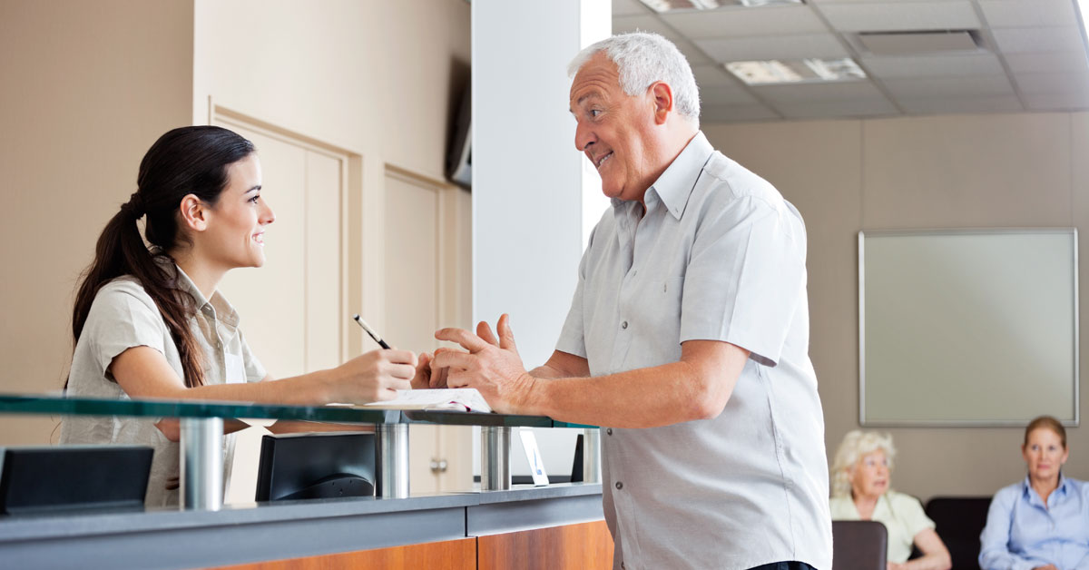 Professional receptionist answering business calls at a front desk